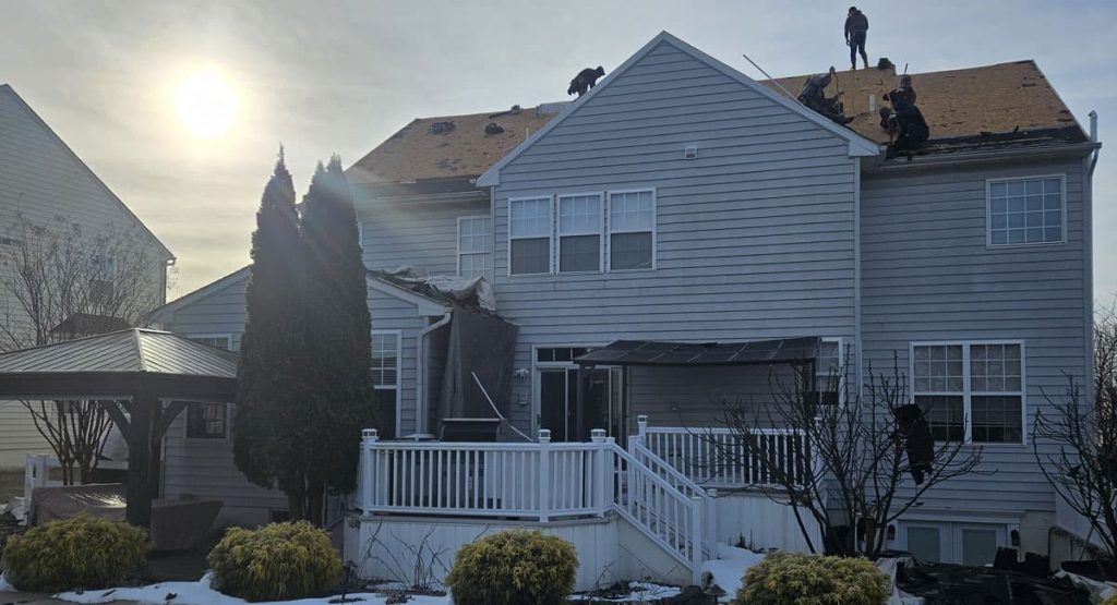 Tearing off old roof in Middletown, DE