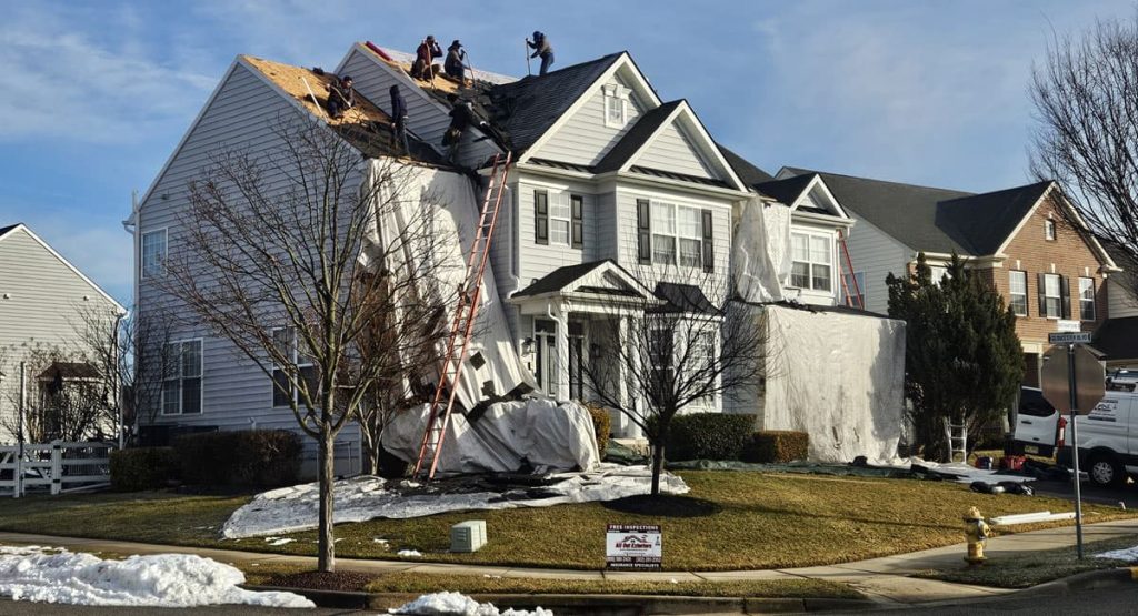 Tearing off old roof in Middletown, DE