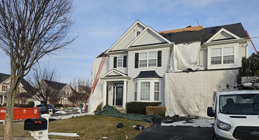 Tearing off old roof in Middletown, DE