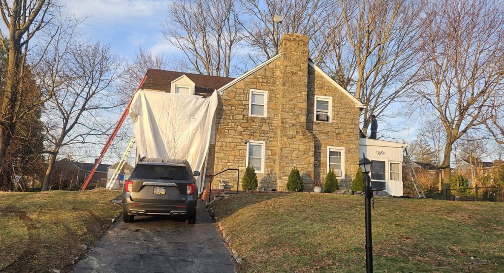 Tearing off the old roof in Elsmere, DE