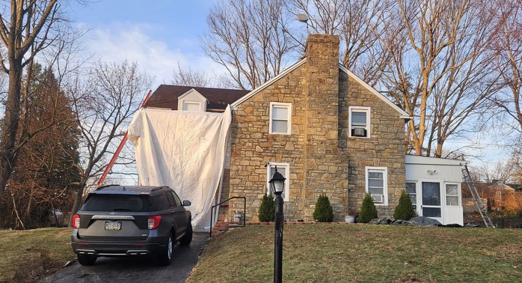 Tearing off the old roof in Elsmere, DE