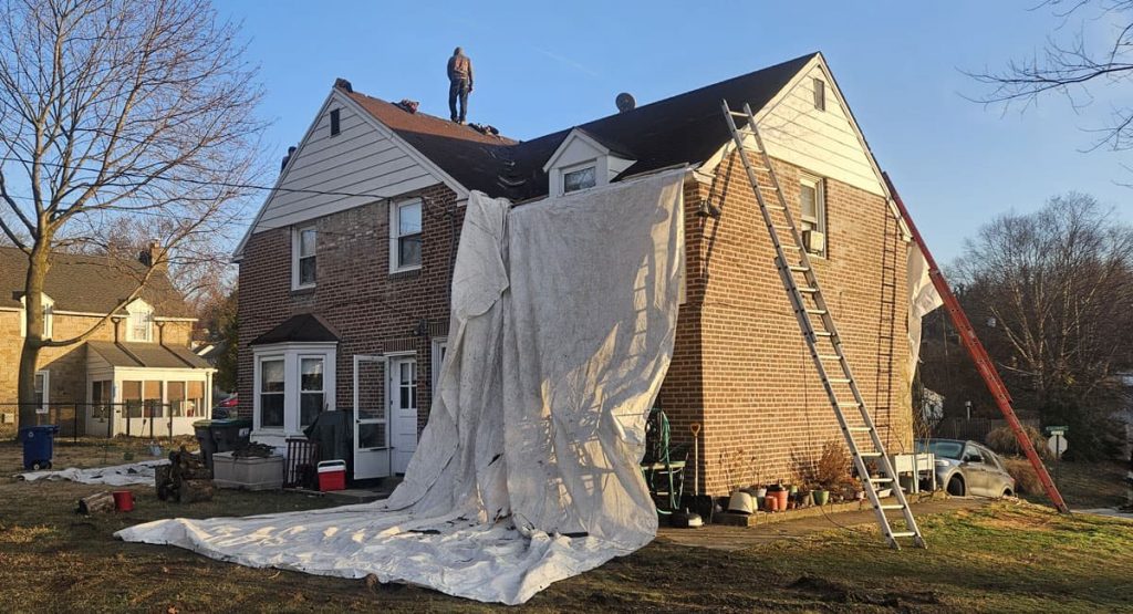 Tearing off the old roof in Elsmere, DE