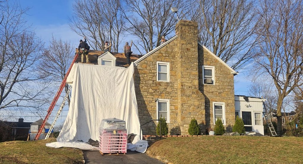 Tearing off the old roof in Elsmere, DE