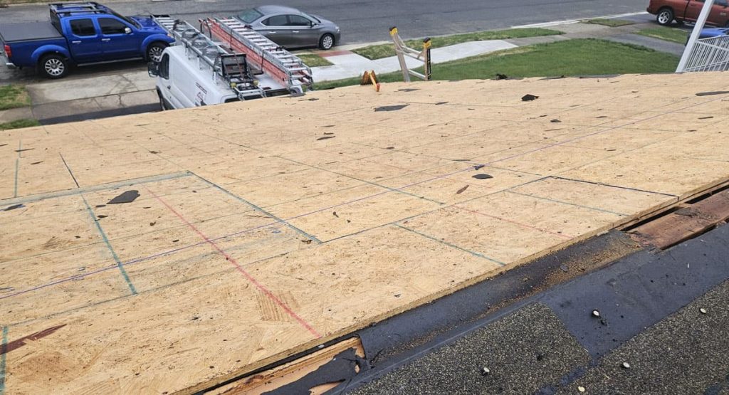 Tearing off old roof in Middletown, DE