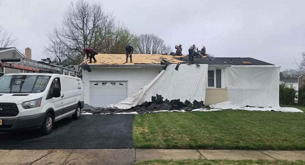 Tearing off old roof in Middletown, DE
