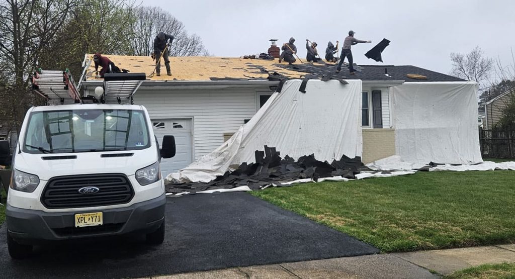 Tearing off old roof in Middletown, DE