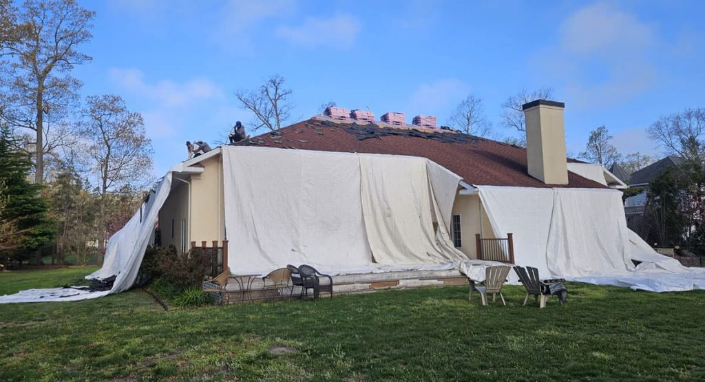 Tearing off the old roof in Milton, DE