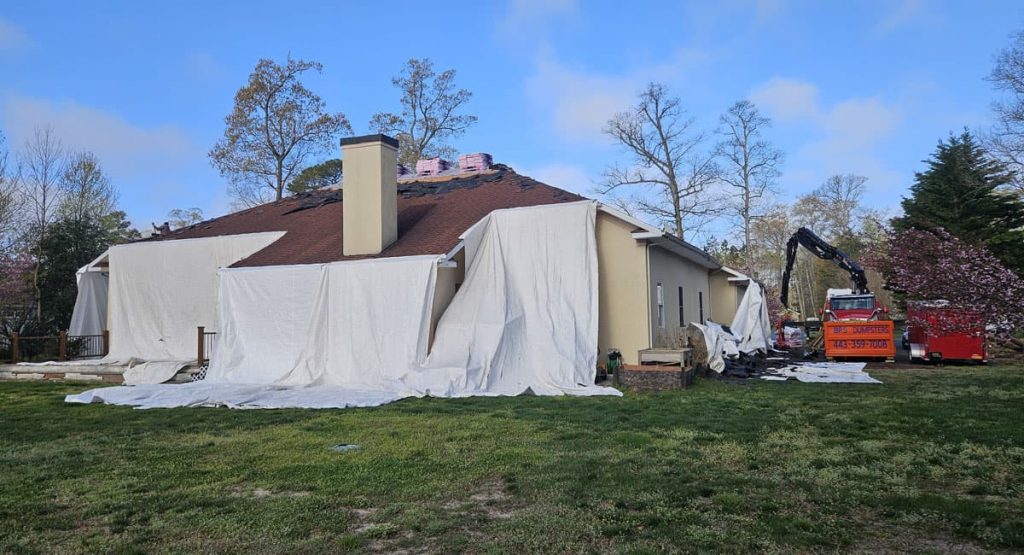 Tearing off the old roof in Milton, DE