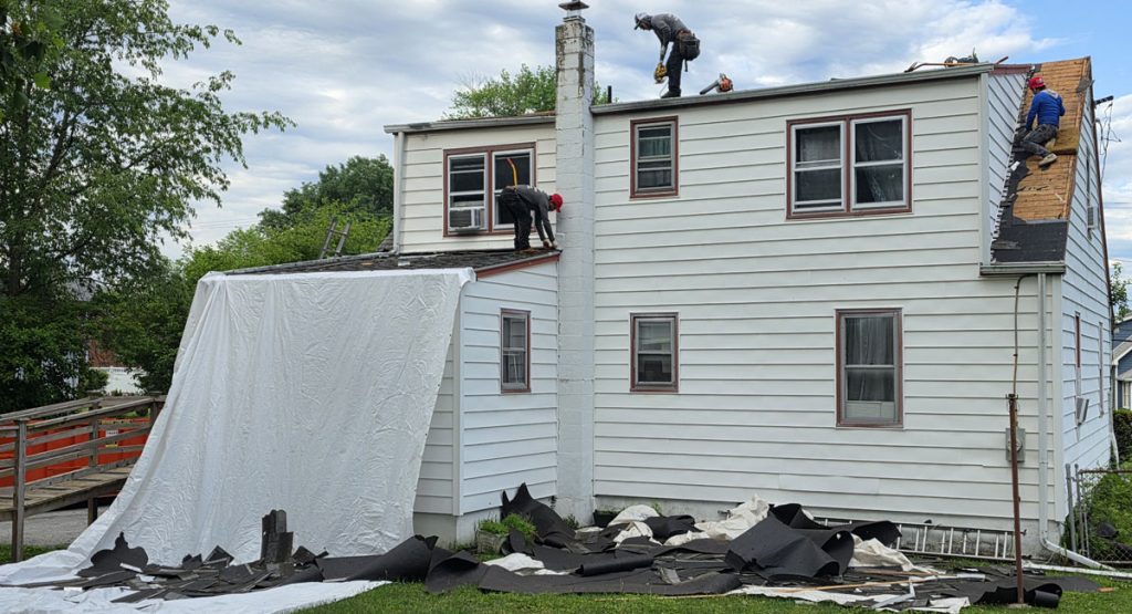 Tearing off the old roof in Chichester, PA