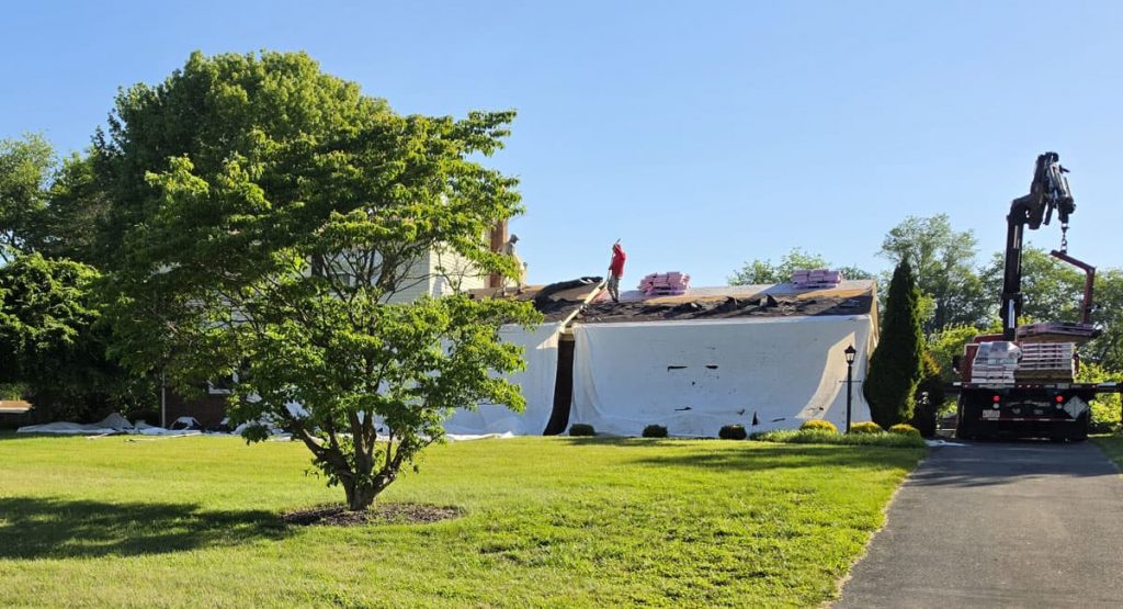 Tearing off the old roof in Newark, DE