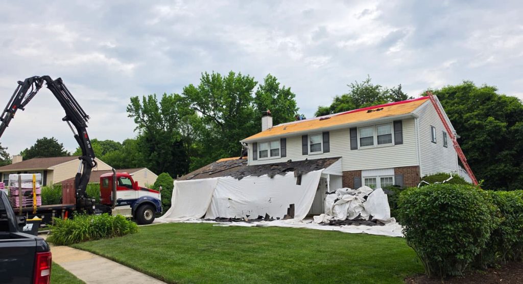 Tearing off old roof in Wilmington, DE
