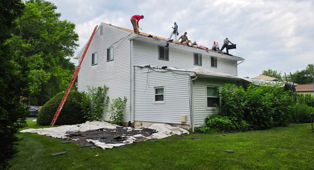 Tearing off old roof in Wilmington, DE