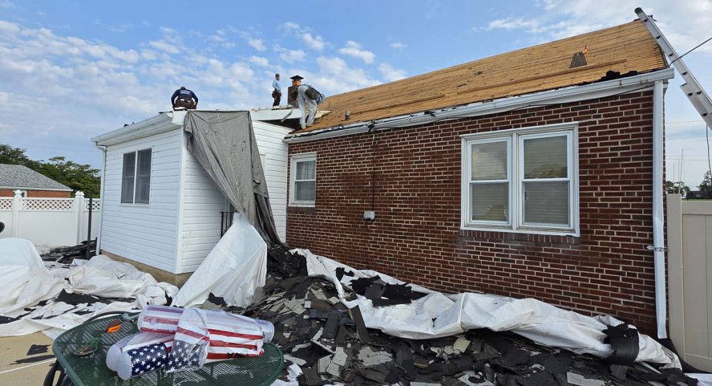 Tearing off the old roof in Elsmere, DE