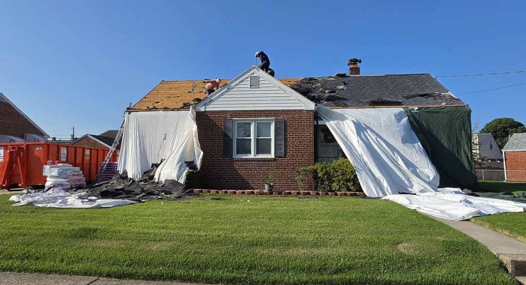 Tearing off the old roof in Elsmere, DE