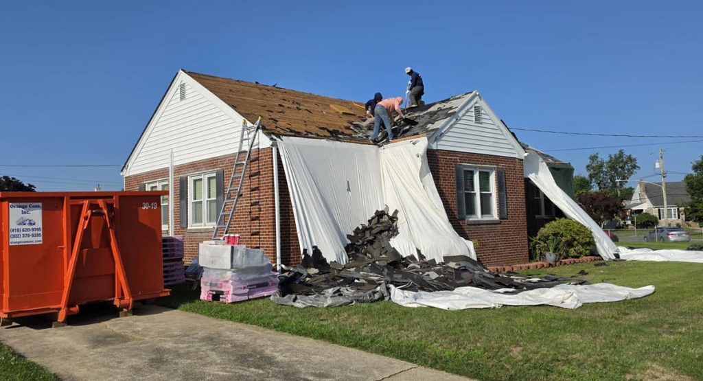 Tearing off the old roof in Elsmere, DE