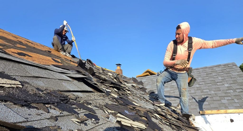 Tearing off the old roof in Elsmere, DE