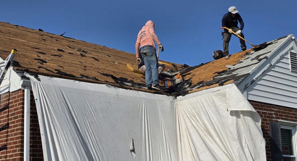 Tearing off the old roof in Elsmere, DE