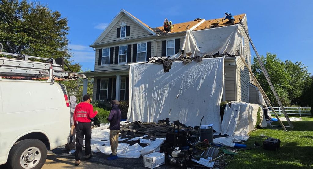 Tearing off old roof in Middletown, DE
