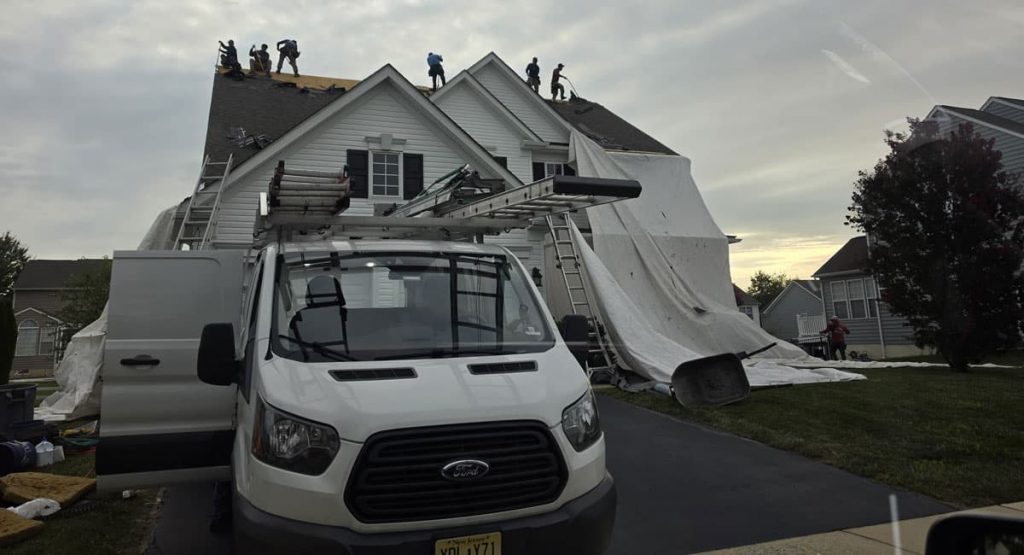 Tearing off old roof in Middletown, DE