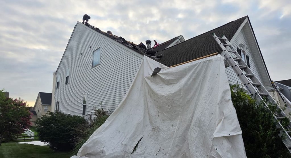 Tearing off old roof in Middletown, DE