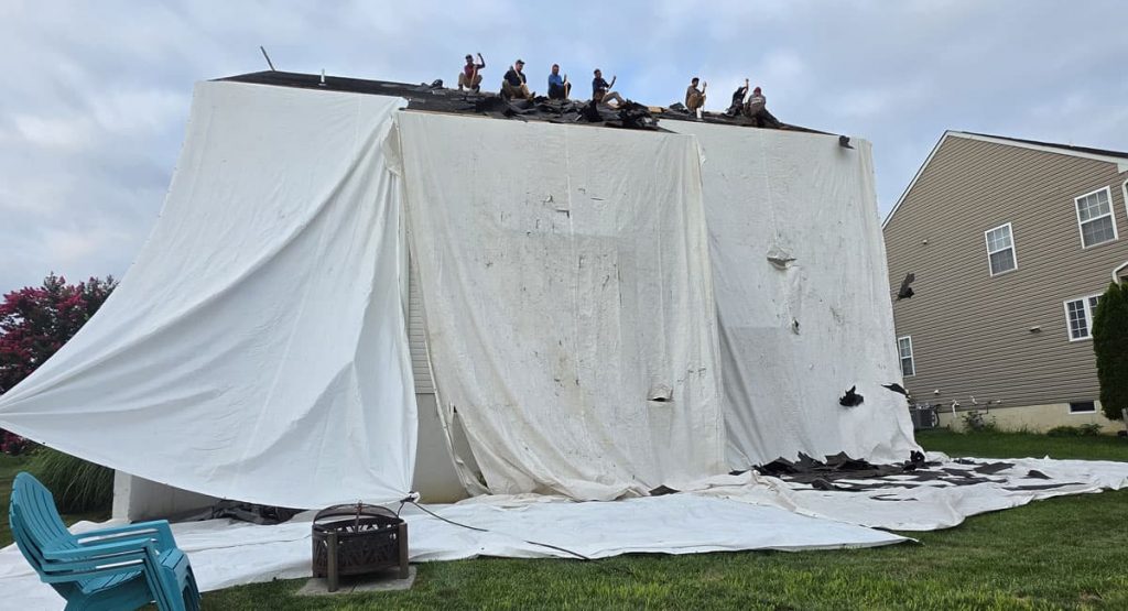 Tearing off old roof in Middletown, DE