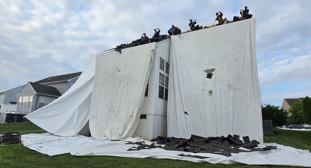 Tearing off old roof in Middletown, DE