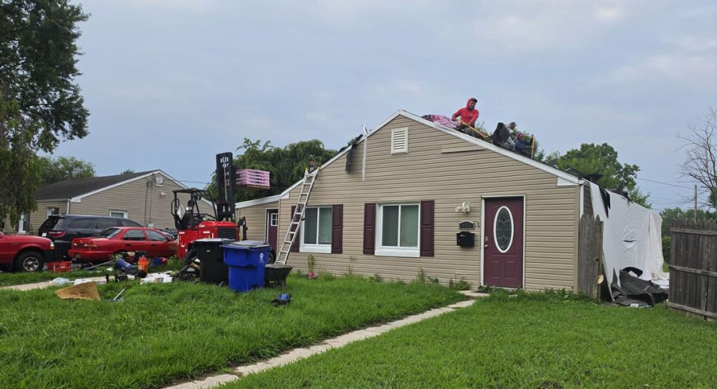 Tearing off the old roof in New Castle, DE