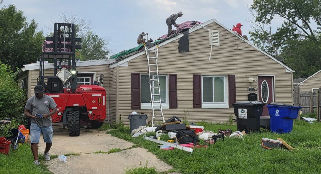 Tearing off the old roof in New Castle, DE