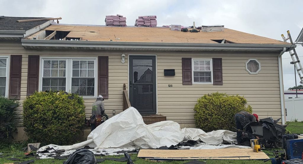 Tearing off old roof in Smyrna, DE