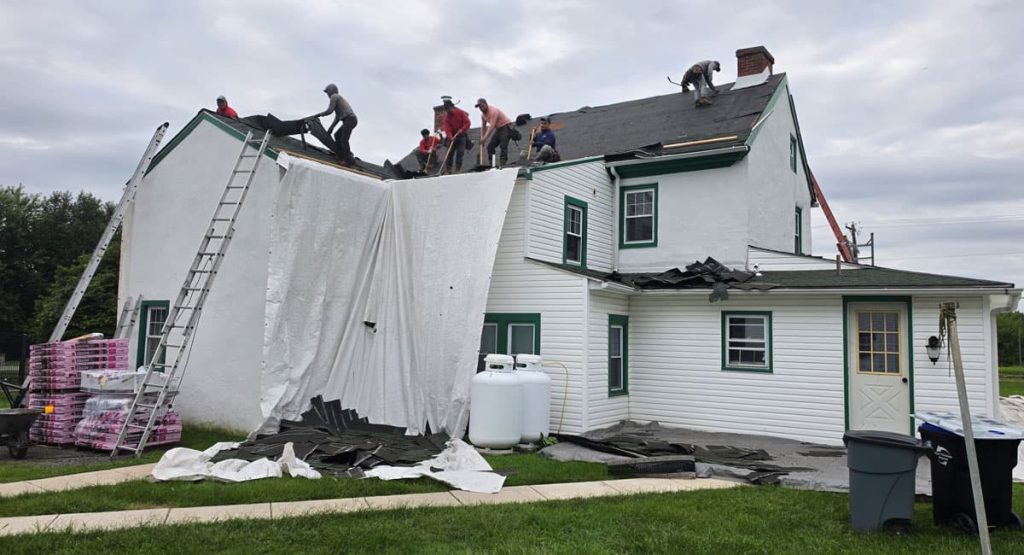 Tearing off old roof in Marcus Hook, PA