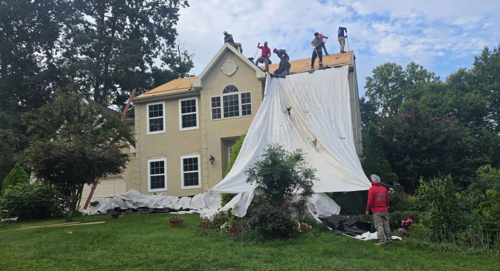 Tearing off old roof in Newark, DE