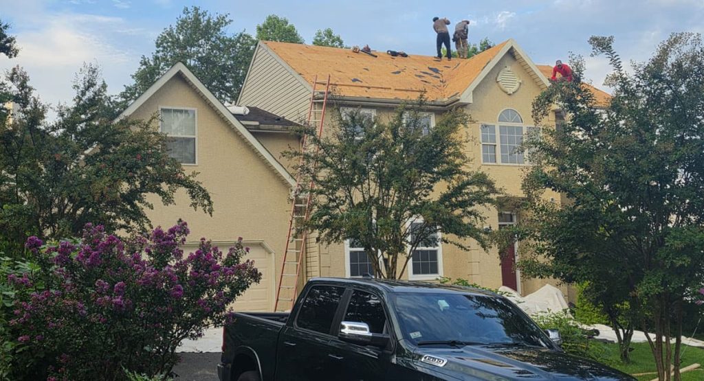 Tearing off old roof in Newark, DE