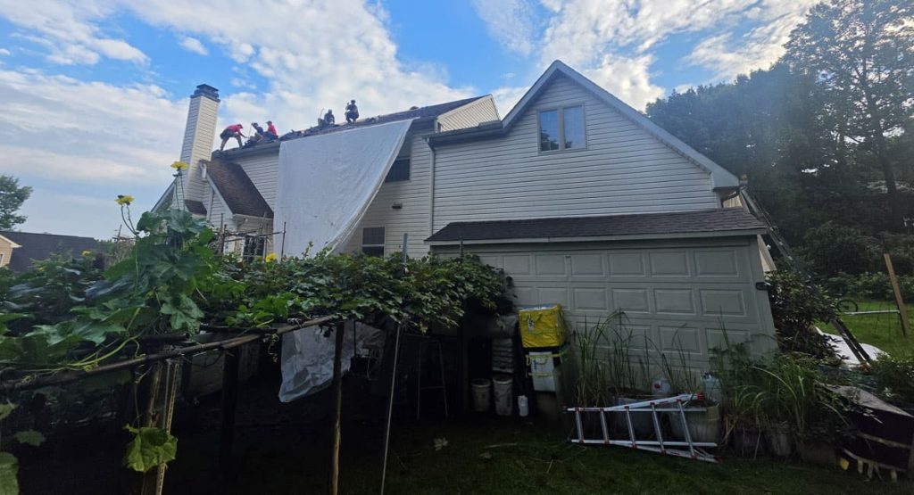 Tearing off old roof in Newark, DE