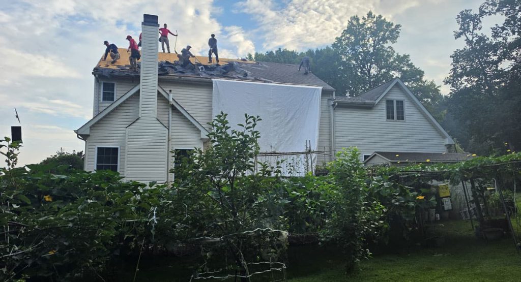 Tearing off old roof in Newark, DE